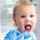 closeup-open-mouth-child-mirror-dentists-hands-blue-gloves-checkup-examine-treating-teeth-child-health-care-children-dental-hygiene